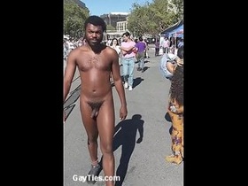 Handsome Nude Ebony man walks o nthe public streets